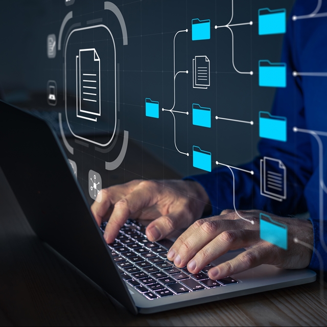 Fingers at computer with data icons