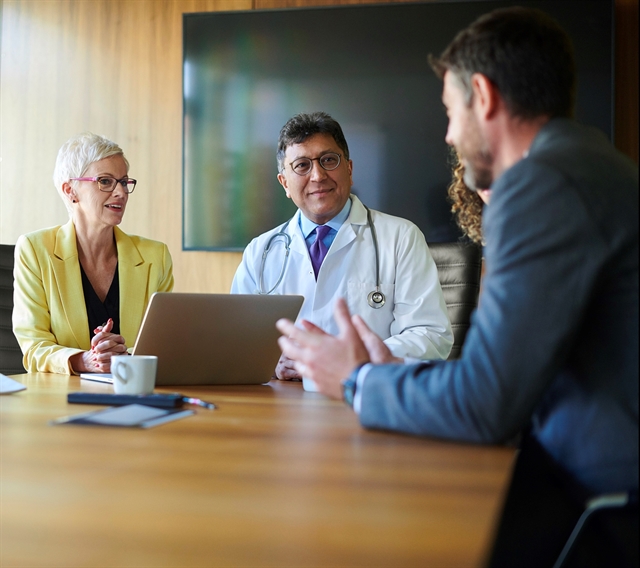 People Meeting in Board Room