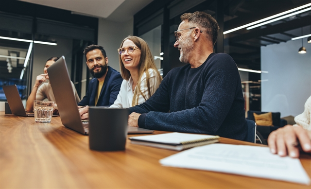 People Working Together in Conference Room